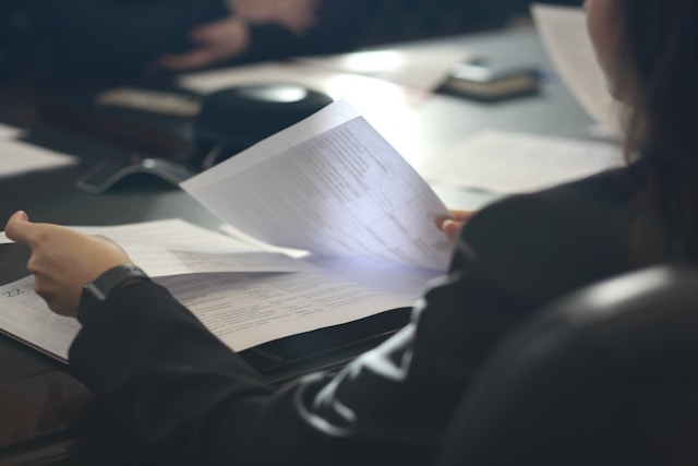 Person reviewing probate documents at a desk